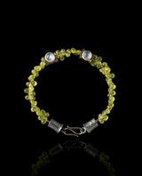 Sidabrinė apyrankė su auksu, peridotais ir mėnulio akmenimis