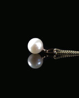 Auksinis pakabukas su perlu